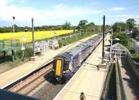 The 12.27 North Berwick - Edinburgh Waverley arrives at Wallyford on 13 May 2014, formed by ScotRail unit 380105.<br><br>[John Furnevel /05/2014]