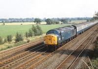 40016 with a northbound train on the ECML near Beningbrough, north of York, in the summer of 1980.<br><br>[Peter Todd 16/08/1980]