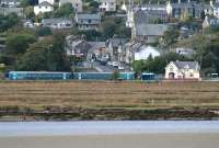 The 1609 service to Machynlleth approaching Penrhyndeudraeth on 14 October. View from the new Llandecwyn station.<br><br>[Colin McDonald 14/10/2014]