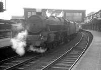 Black 5 45006, wearing a 2B, Oxley, shed plate, waits to leave Carlisle platform 5 on 4 July 1964 with the 7.11pm stopping service to Warrington. A DMU for Newcastle Central stands at platform 6.<br><br>[K A Gray 04/07/1964]