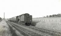 BR Standard class 5 4-6-0 no 73058 running between Uplawmoor and Lugton East Junction with empty stock on 15 June 1961. [Ref query 6575]<br><br>[G H Robin collection by courtesy of the Mitchell Library, Glasgow 15/06/1961]