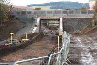 The rebuilt bridge carrying Winston Road over the Borders Railway, looking north west along the trackbed towards Galashiels station on 24 October 2014. [See image 42351]<br><br>[John Furnevel 24/10/2014]