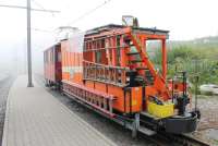 Standing in the mist at the summit of the Rochers de Naye rack railway in September 2013 is ancient loco No.2 and a custom built engineering wagon equipped for a variety of tasks including fire fighting. [See image 44656]. These vehicles are based at the line's Glion depot, part way up the hill from Montreux. <br><br>[Mark Bartlett 09/09/2013]