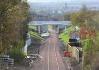 The view south towards the new Eskbank station on Sunday 26 October 2014. Note the pedestrian crossing over the trackbed has been removed and access blocked [see image 48945], with the east-west walking route to the south of the station now restored via the rebuilt bridge.<br><br>[John Furnevel 26/10/2014]