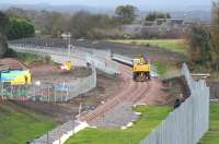 Shortly after passing south through the new Eskbank station on 27 October, a roadrail machine is about to cross the bridge over Hardengreen roundabout.<br><br>[John Furnevel 27/10/2014]