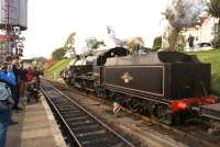 Southern Railway U Class 2-6-0 no. 31806 departs from Swanage with a short goods train on 19 October 2014 during the Railway's Autumn Steam Gala. <br><br>[John McIntyre 19/10/2014]