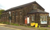 The converted former goods shed at Panteg and Griffithstown in August 2014. It must be very practical to use such a building as a nursery [see image 10016] - even the most distraught toddler would find it hard to break a window. Notice the bus stop equivalent of the 'Harrington Hump' on the left.<br><br>[Ken Strachan 24/08/2014]