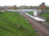 View north, taken from the bridge which now carries the public footpath over the line to the south of the new Eskbank station. The bridge was built as a replacement for the original stone structure which had been filled in along with a large section of the cutting following closure of the Waverley route. [See image 34354]<br><br>[John Furnevel 27/10/2014]