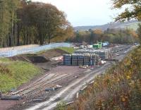 Scene at Tweedbank terminus on 24 October 2014, with platform construction well underway beyond the stockpiles of concrete sleepers.<br><br>[John Furnevel 24/10/2014]