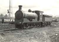 J36 0-6-0 no 65296 stands in the yard at Balloch in April 1957. Balloch shed (BR code 65I) closed in November 1960 only to be reopened shortly thereafter due to problems with the new electric <I>'Blue Trains'</I>. The shed closed for the second and final time in September 1961. [See image 32327]<br><br>[G H Robin collection by courtesy of the Mitchell Library, Glasgow 20/04/1957]