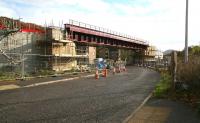 The new railway bridge under construction spanning Currie Road, Galashiels. Photographed on 24 October 2014 looking south east towards Tweedbank, with the Eildon Hills visible in the right background. <br><br>[John Furnevel 24/10/2014]