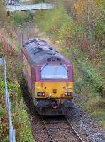67009 passes the overgrown platforms at Easter Road on its return from Powderhall Refuse Depot to Millerhill on 28 October 2014.<br><br>[Bill Roberton 28/10/2014]