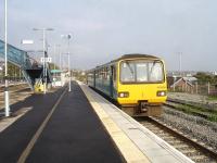 143606 stands at restored island platform 3 at Barry station on 30 October 2014 with the 10.51 ex Aberdare to Barry Island service. The platform is bi-directionally signalled.<br><br>[David Pesterfield 30/10/2014]