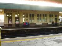 The platform buildings at Cardiff Central remain virtually as built, as seen in this view of the west end waiting room and toilet block on Valley Line island platforms 6/7 on 30 October 2014.<br><br>[David Pesterfield 30/10/2014]