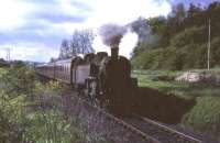 An unidentified BR Standard 2-6-4 tank about to enter Thorntonhall station in June 1965 with the 5.33pm from St Enoch.<br><br>[G W Robin /06/1965]