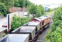 Coal empties from Cockenzie power station run over Seafield level crossing and enter Leith South yard on 9 June 2005 on their way back to Leith Docks behind EWS 66078.  <br><br>[John Furnevel 09/06/2005]