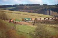 66605 leads a ballast train down Borthwick Bank on 3 November with Borthwick Castle in the background. <br><br>[Bill Roberton 03/11/2014]