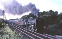 70002 <I>Geoffrey Chaucer</I> climbing through Braidwood on 16 July 1965 with a London bound relief. <br><br>[John Robin 16/07/1965]