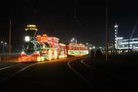 <I>Western Locomotive</I> 733 and its carriage 734 stand on the Pleasure Beach loop prior to working through the illuminations to Little Bispham on 5 November 2014. The illuminated Western Train was stored from 1999 but restored to service in 2009 with the help of a £278,000 lottery grant. The driver sits in the <I>smokebox</I> and the black painted pantograph can just been seen on top of the <I>cab</I>.<br><br>[Mark Bartlett 05/11/2014]