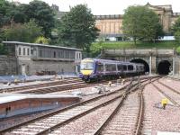 A mid-morning service from Glasgow Queen Street arrives at Waverley past the old west box during major works being carried out at the station in September 2007. Note the absence of catenary and associated clutter, with only the north tunnel under The Mound electrified at the time.<br><br>[John Furnevel 06/09/2007]