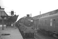 Miltary special 1X36, on its way from Halton to Rutherglen, having stopped to change engines at Carlisle on 31 July 1965. About to take the train forward is Polmadie Standard class 5 4-6-0 no 73072.<br><br>[K A Gray 31/07/1965]