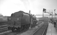 Holbeck Jubilee 45593 <I>Kolhapur</I> standing in wait at Leeds on 15 July 1967. 45593 will relieve the locomotive off the incoming 6.40am Birmingham New Street - Glasgow Central, a train which ran via the S&C and G&SW routes.<br><br>[K A Gray 15/07/1967]