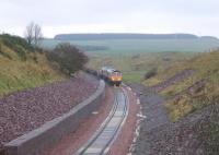 The day after reaching Scottish Borders Council territory, the rail-laying train inches south towards Falahill on 6 November 2014 - seen from the infamous Overbridge 41 [see Image 48014].<br><br>[David Spaven 06/11/2014]