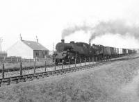 Standard class 4 tank 80020 pilots LMS 2P 40622 past Kirkton on 4 August 1954 with a lengthy fish train southbound from Fraserburgh. Running in parallel on this side of the fence is the St Combs branch. <br><br>[G H Robin collection by courtesy of the Mitchell Library, Glasgow 04/08/1954]