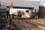 With the former level crossing in the foreground replaced by a new road bridge over the railway (behind the camera), work is now progressing on refurbishing the station footbridge at Wareham. On the afternoon of 19 October 2014 SWT emu no. 444043 waits to commence its journey to Waterloo. This was as far as westbound services were running this particular Sunday due to engineering works near Dorchester.<br><br>[John McIntyre 19/10/2014]