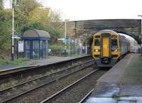 <I>Harrington Humps</I> are normally installed to access the front door of trains but there is limited clearance on the Down platform at Pleasington and the hump has been set up for rear doors, leading to a trio of <I>2 Car stop</I> signs for drivers of the 142, 150 and 156 units used on local services. 158793 passes through the Up Platform, which has been raised along most of its length, on a York-Blackpool working.  <br><br>[Mark Bartlett 12/11/2014]