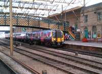 The 1400 Manchester Airport - Edinburgh Waverley TransPennine Express service calls at Carlisle on 20 May 2014.<br><br>[Ken Strachan 20/05/2014]