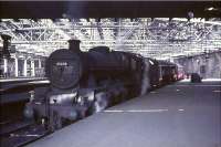 Platform scene at Glasgow Central on Saturday 17 July 1965. Liverpool Bank Hall Jubilee 4-6-0 no 45698 <I>Mars</I> is awaiting its departure time with a train for Liverpool/Manchester Victoria. [See image 46723]  <br><br>[John Robin 17/07/1965]