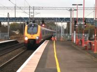 Not something you see every day - a track gang working close to a high speed line at Birmingham International on 11 November. The PICOW became (understandably) quite animated as this Birmingham New Street bound Voyager approached.<br><br>[Ken Strachan 11/11/2014]