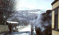 BR Standard tank 80093 makes a photostop at Killin on 12 April 1963 with <I>Scottish Rambler No 2</I> during a welcome break in the wintry weather. The train would shortly continue on its journey to Loch Tay. Note the <I>Camping Coach</I> in the siding to the left.<br><br>[John Robin 12/04/1963]
