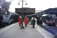 4472 <I>Flying Scotsman</I> stands at Aberdeen on 16 May 1964 preparing to return to Edinburgh with a special. Alongside is 60027 <I>Merlin</I>, about to leave with one of the scheduled 3 hour services to Glasgow Buchanan Street. The special had been organised by the Queen's College Railway and Transport Society of St Andrew's University, whose gowned officials adorn the platform.    <br><br>[John Robin 16/05/1964]