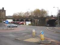 Looking north west towards the old coal drops at the east end of the former Penistone goods yard, sited some distance west of the station.  The old railway bridge crosses the B6462, which links the town centre and the main A628 Barnsley to Manchester road. [Ref image 6777]<br><br>[David Pesterfield 13/11/2014]