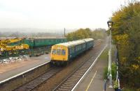 A wet and miserable 16 November at the East Anglian Railway Museum, with a 2-car DMU set standing alongside on the Museum's tracks. On the right is the platform serving the Sudbury branch looking south towards Marks Tey. <br><br>[Peter Todd 16/11/2014]