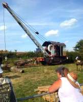 A handy thing to have in your shed: a rail mounted steam crane demonstrating its capabilities at the Welland Steam Rally in July 2014. The chap on the right seems to be trying to dissuade his labrador from fetching the large stick on the left.<br><br>[Ken Strachan 26/07/2014]