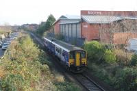 150269 pulls away from Lytham on a Northern service for Colne. The train is just passing the site of Lytham's first station, terminus of a branch from Kirkham. It closed in 1874 when the through line to Blackpool was opened but remained open for goods until 1963. Booths car park and Lytham Fire Station now occupy the site of the old station and yard.   <br><br>[Mark Bartlett 18/11/2014]