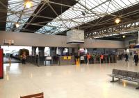 Looking across the concourse at Inverness on 19 November 2014. The train waiting to depart from platform 6 is the 12.17 local service to Dingwall. The 32 minute journey includes stops at Beauly, Muir of Ord and Conon Bridge.<br><br>[Andy Furnevel 19/11/2014]