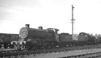 A lineup of stored locomotives on Eastleigh shed in September 1963 includes ex-LBSCR 'K' class 2-6-0 no 32345.<br><br>[K A Gray 25/09/1963]