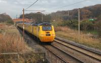 HSTs were once a common sight on the WCML on Virgin Cross Country services but the only movements nowadays are the occasional outings of the Network Rail Measurement Train. 43062 <I>John Armitt</I> brings up the rear of a Derby RTC to Craigentinny working at Woodacre on 25th November 2014.<br><br>[Mark Bartlett 25/11/2014]