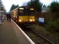 Dusk at Crookston station on the Paisley Canal branch on 26 November 2014. Unit 314216 stands at the platform.<br><br>[John Yellowlees 26/11/2014]