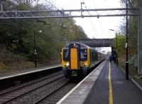 The leafy suburbs of Birmingham on 11 November. London Midland 350110 with a lunchtime working to New Street calls at Hampton-in-Arden. [See image 49417]<br><br>[Ken Strachan 11/11/2014]