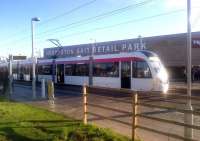A tram calls at Edinburgh Park on 30 November 2014. Edinburgh Trams started carrying passengers on 31 May, so have now been in public service for six months.<br><br>[John Yellowlees 30/11/2014]