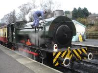 Hunslet 1944 built ex WD J94 132 <I>Sapper</I>, at Grosmont on 30 November on the rear of a recently returned 11.45 7 coach 'Santa Special'. After being checked for water it was then uncoupled and taken to the shed for a top up before taking out the 13.45 working, ably assisted by standard 4 2-6-0 76079, which provided most of the propulsion up the southbound gradients from the rear of the train. <br><br>[David Pesterfield 30/11/2014]