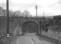This location is now unrecognisable, the bridge having been demolished many years ago and the road realigned over to the left. The location is west of Clovenfords looking south-west along the A72 just before its junction with the A707 at The Nest (the River Tweed and Peel on its far bank are hidden by the trees). The No.16 on the bridge is not a railway bridge number but a card affixed by the photographer to facilitate identification of the locations portrayed on his glass plate negatives.<br><br>[Bill Jamieson Collection //]