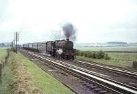 Carstairs based Black 5 no 45173 on Strawfrank Troughs with a Lockerbie train on 24 July 1964. The train has just cleared Float Viaduct which can be seen in the left background. 45173 was withdrawn from 64D later that same month. <br><br>[John Robin 24/07/1964]