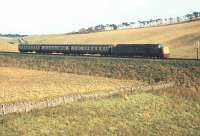 A diverted service off the Edinburgh - Carstairs route heading south at Falahill in 1968 behind an unidentified EE Type 4 locomotive. [See image 49631]<br><br>[Bruce McCartney //1968]