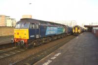 Supplementing Northern services into and out of Manchester from the Chorley area on Saturdays until Christmas is a 6 coach Mark 2 set with a DRS loco on either end. On 29 November 47818 is on the rear of the set calling at Salford Central heading for Manchester Victoria.<br><br>[John McIntyre 29/11/2014]